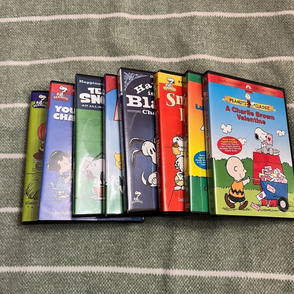 Peanuts VHS Set with Colorful Character Covers - Red, Yellow, Green, Blue, Black